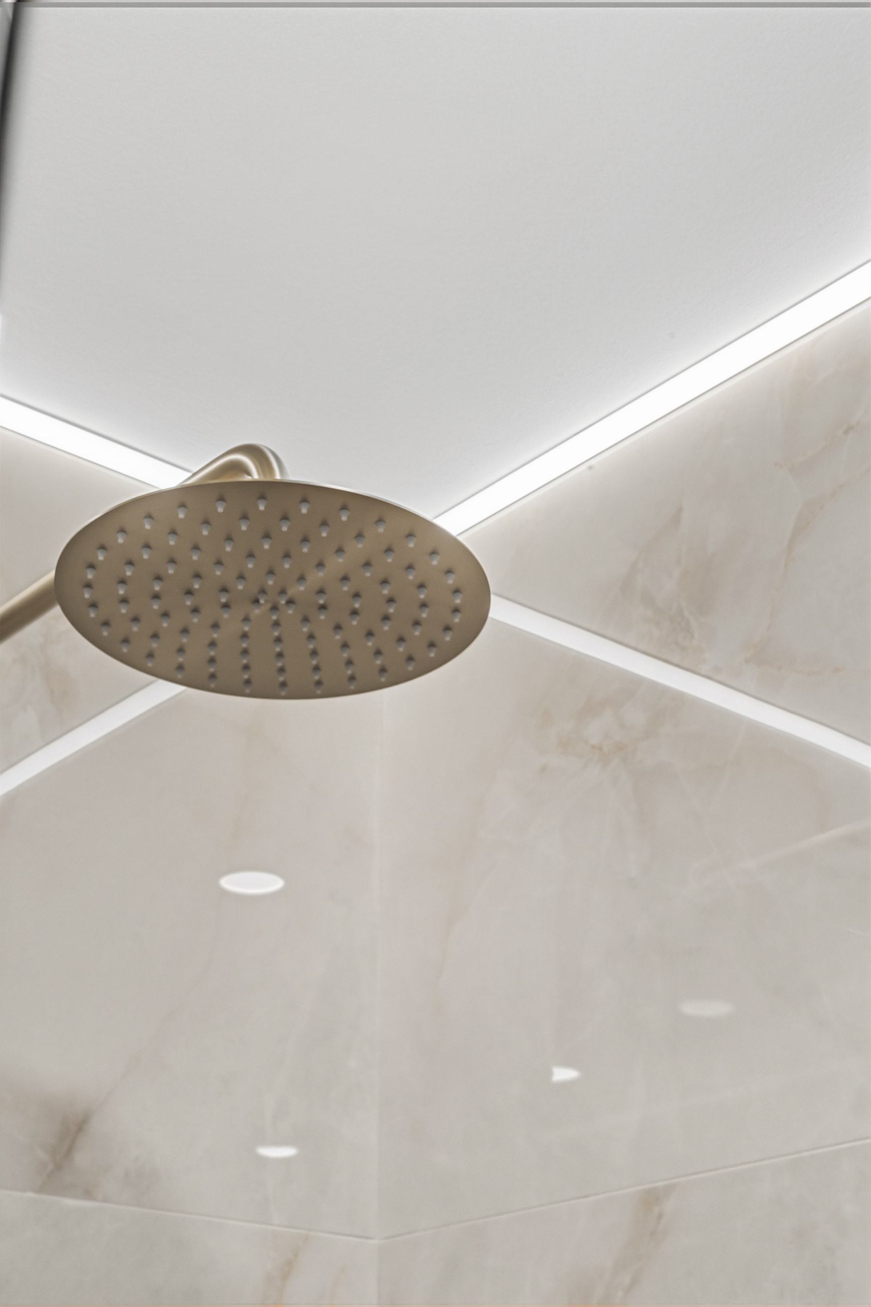 The rain head below a ceiling cove, the light washing down the porcelain.