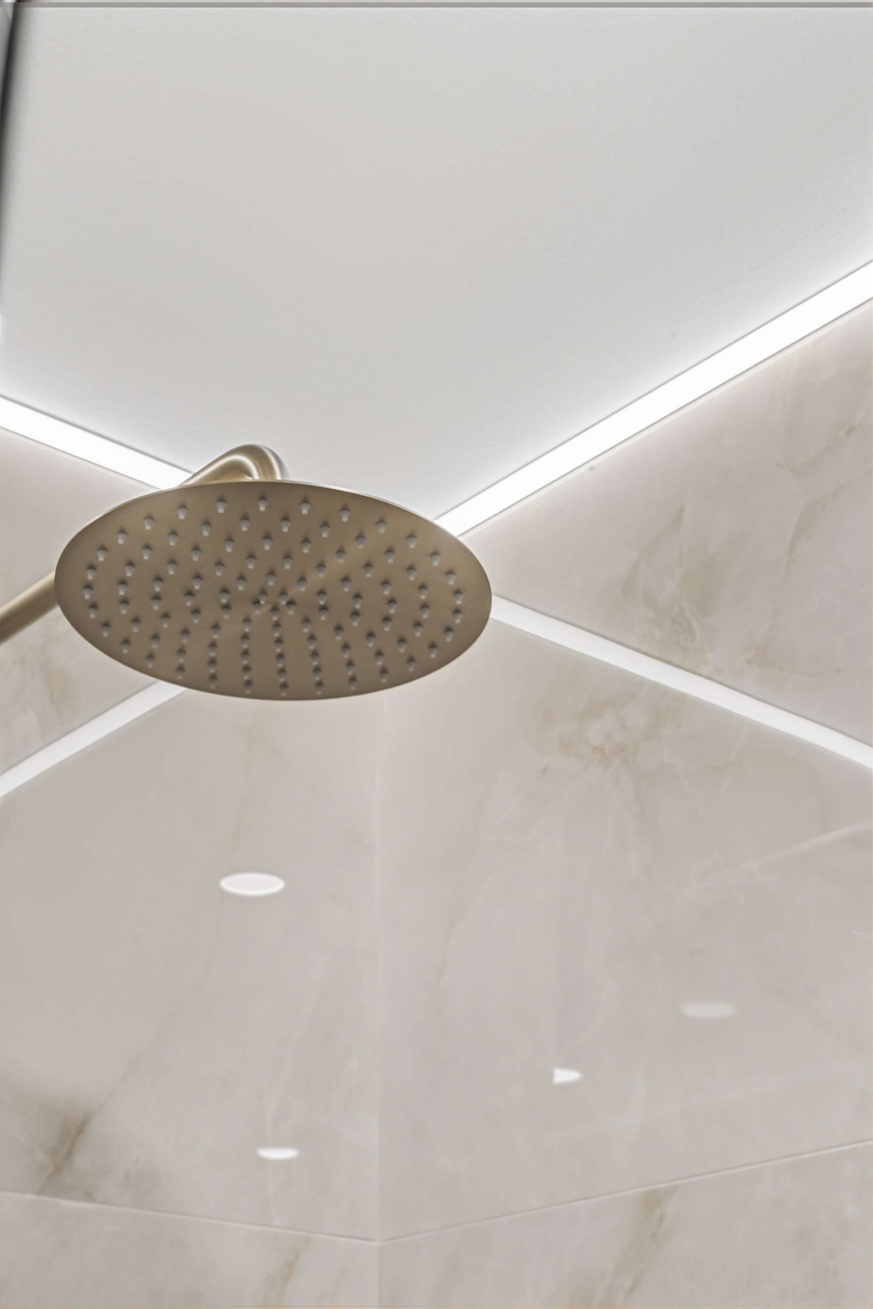 The rain head below a ceiling cove, the light washing down the porcelain.