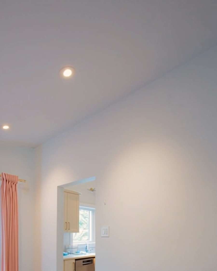 Before: a plain wall with a narrow doorway through to the old kitchen.